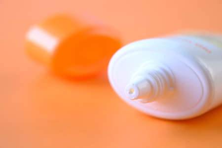 Close up of sunscreen cream in a pink containerの写真素材