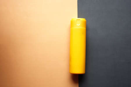 top view of sunscreen cream or orange backgroundの写真素材