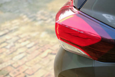 rear left car lantern on red SUVの写真素材