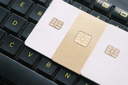high angle view of credit cards on laptop on table