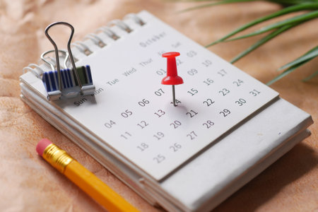 deadline concept with push pin on calendar date close up