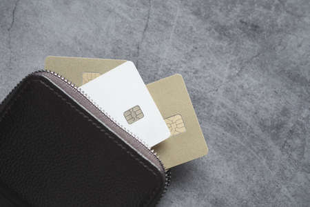 close up of credit cards in a wallet on wooden backgroundの写真素材