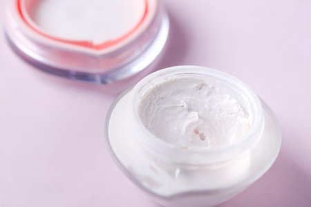 Close up of beauty cream in a pink container
