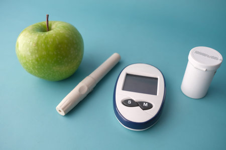 diabetic measurement tools, apple on table