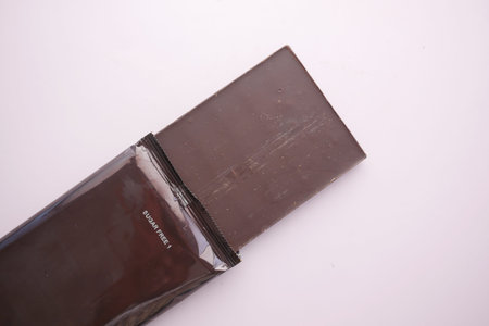 dark chocolate on a plate on table close up