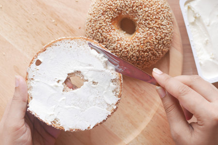 cheese cream spread on fresh bagel bread
