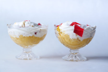 mango flavor ice cream in a glass on white backgroundの写真素材