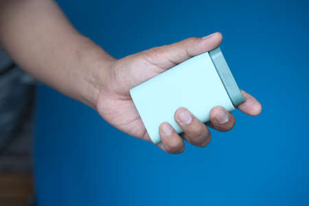 mans hands taking medicine from a pill boxの写真素材