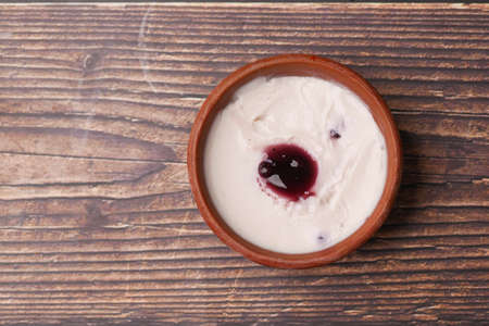fresh blueberry yogurt in a bowl on tableの写真素材