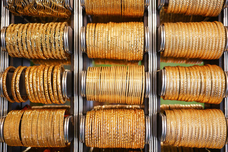 golden color bangles display for sale at local store ,