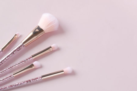 beauty brush on light pink background