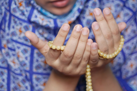 Close up of muslim women hand praying at ramadanの写真素材