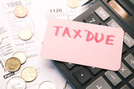 Tax return form and hand written tax due on table