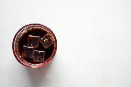 f soft drinks with ice cube on white background