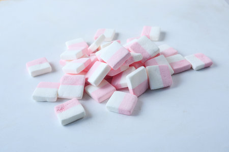 marshmallow candy in a bowl on white background