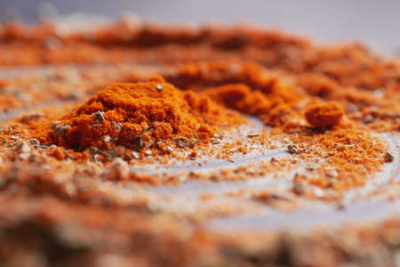 Chili powder and red peppers on table background.の写真素材