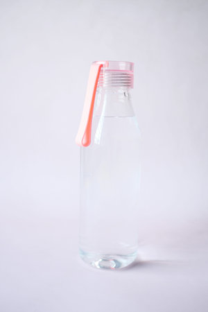 fresh drinking water in a pink color bottleの写真素材