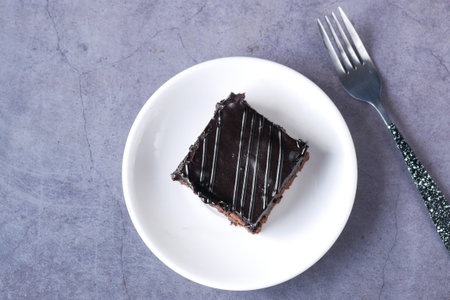 slice of brownie on plate on table