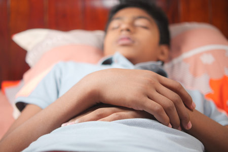 teenage boy boy sleeping in bed, selective focus .