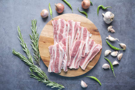 top view raw meat on chopping board on a chopping boardの写真素材