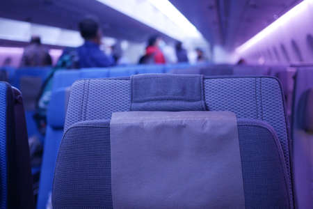 purple color Empty passenger airplane seats in the cabinの写真素材