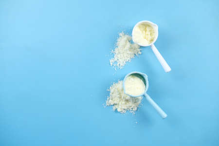 top view of baby milk powder and spoon on tile background.の写真素材