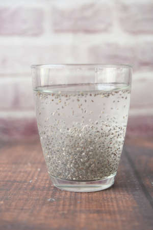 close up of chia seeds in a glass of waterの写真素材