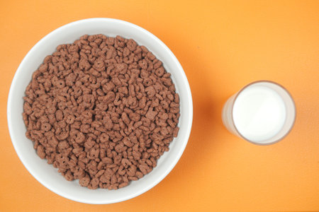 chocolate corn flakes in a bowl on table