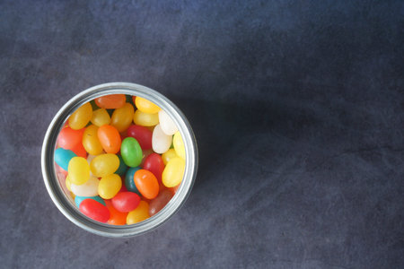 top view of Jelly beans in a bowl on black