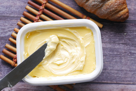 close up of fresh butter in a containerの写真素材