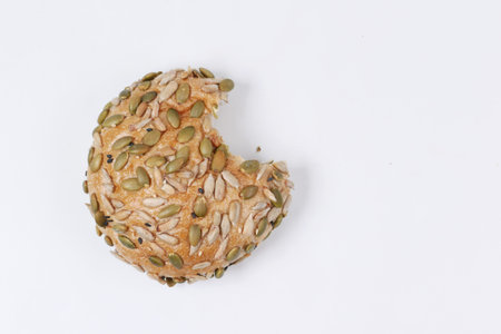 detail shot of sunflower seed baked bread on white background