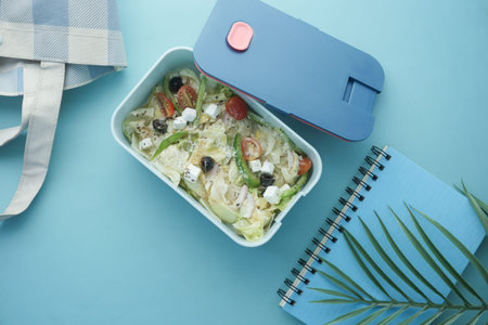 top view of a lunch box on color background