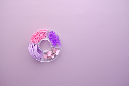 purple color office stationary in a plastic box ,