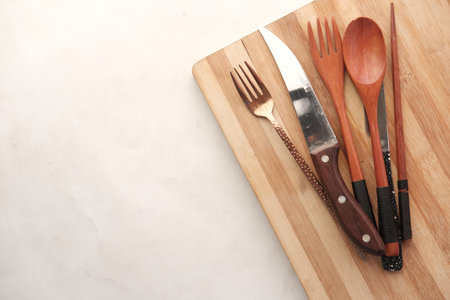wooden chopping board on black background top down