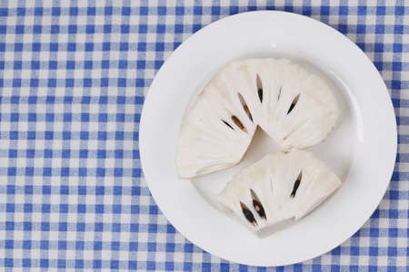 soursop fruit on a plate on tableの写真素材