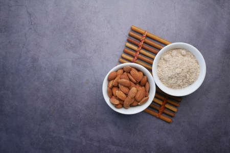 almond powder and almond in a jar on table,の写真素材