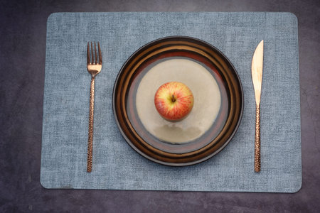 cutlery and empty plate on table top viewの写真素材
