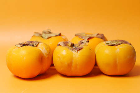 top view of persimmon on white backgroundの写真素材