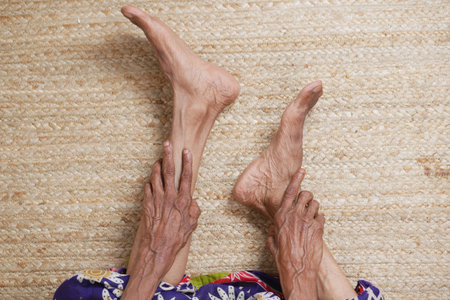 senior women feet and hand massage on injury spot.の写真素材