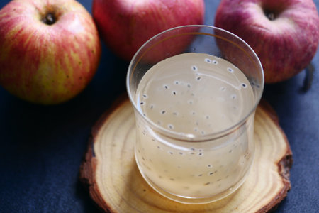 seed apple juice in a glass on table