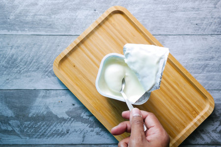 fresh yogurt in a bowl on table