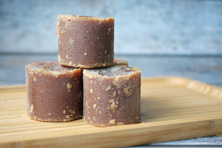Jaggery traditional cane sugar cube on table
