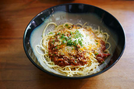 plate of cream and herb pasta on tableの写真素材