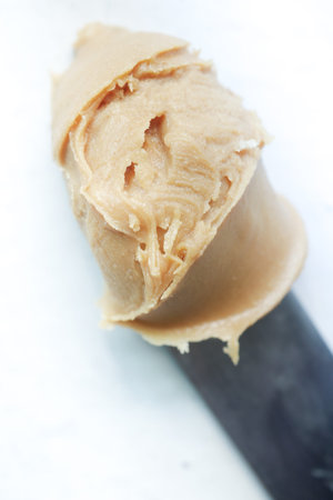 close up of peanut butter on knife