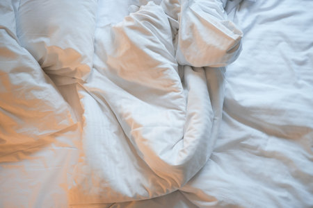 messy bed in early morning , messy bed after waking upの写真素材