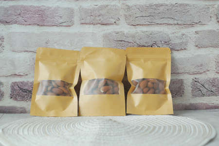 almond nuts in a packet on tableの写真素材