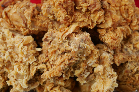 detail shot of fried chicken fillets on plateの写真素材