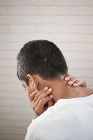 sad teenage boy head downの写真素材