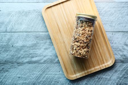 top view of granola Musli in a glass jar on table