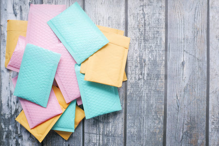 colorful paper bubble envelope on table